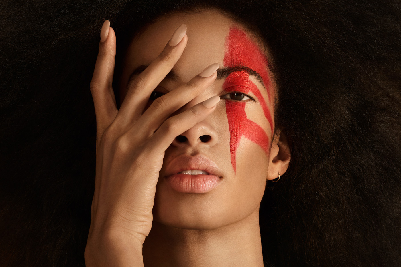 studio_beauty_editorial_portrait_of_dancer_Miranda_Chambers_with_red_face_paint_photographed_by_Sara_Lehtomaa
