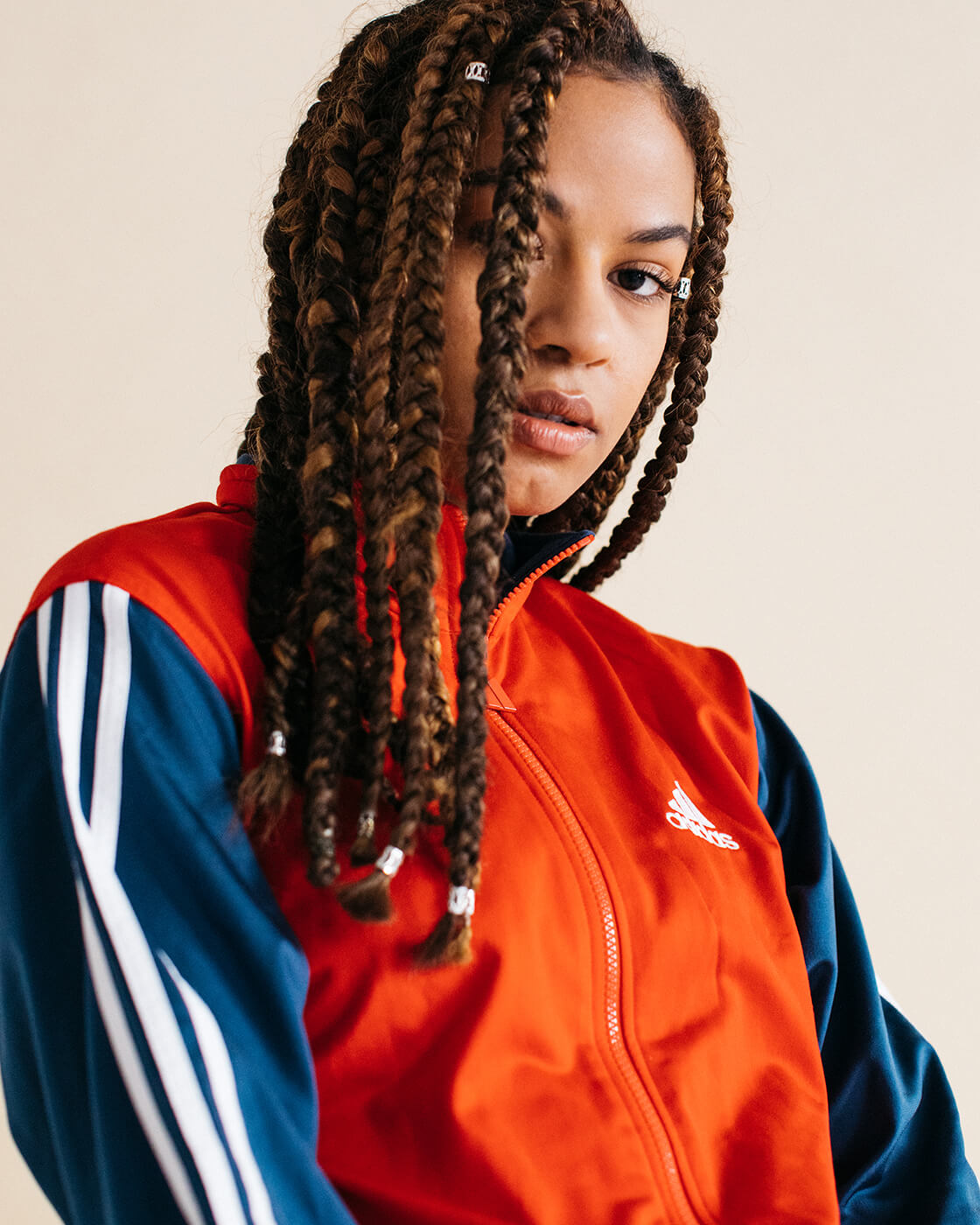 A colorfull portrait of a young girl wearing a red tracksuit