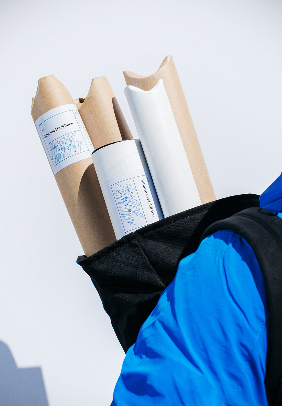 Cardboard tubes in a couriers backbag
