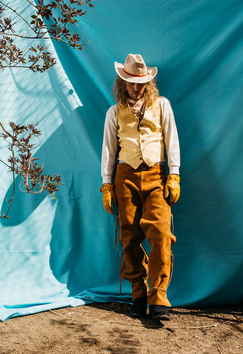 A portrait of a man wearing cowboy clothing