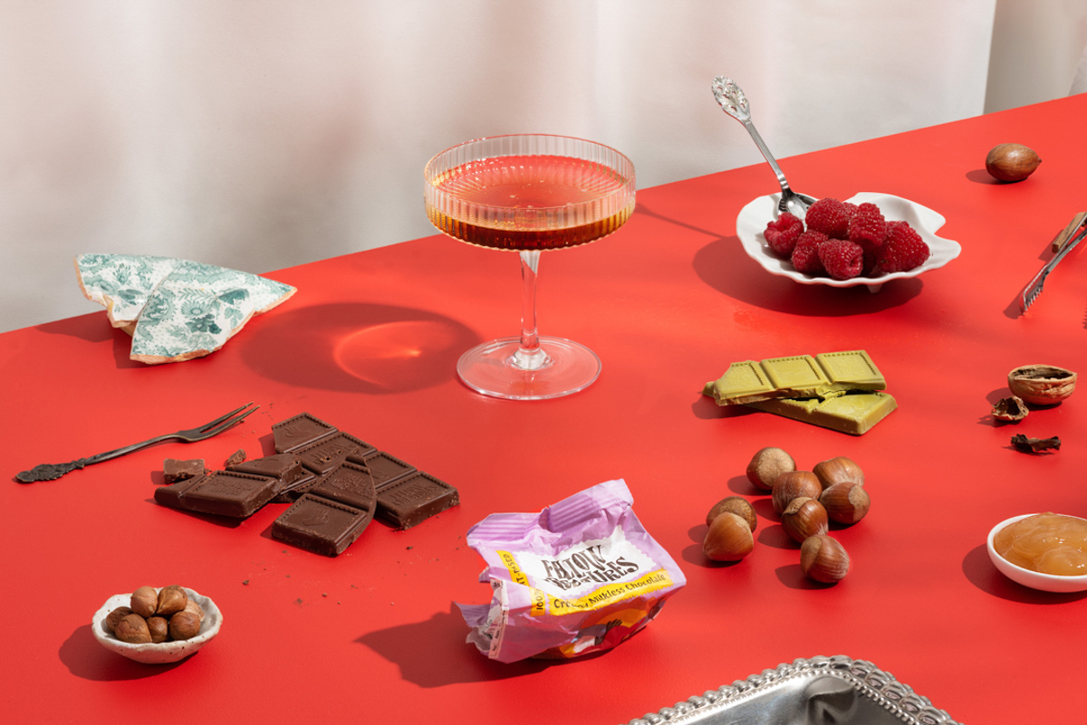 edible things layed out on a table of red by Tomas Olsen